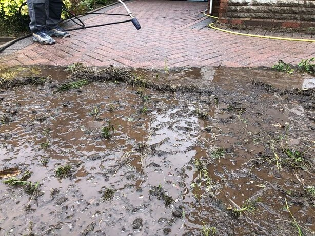 A & J Driveways professional high-pressure jet washing and restoration on a block paving driveway in Dudley