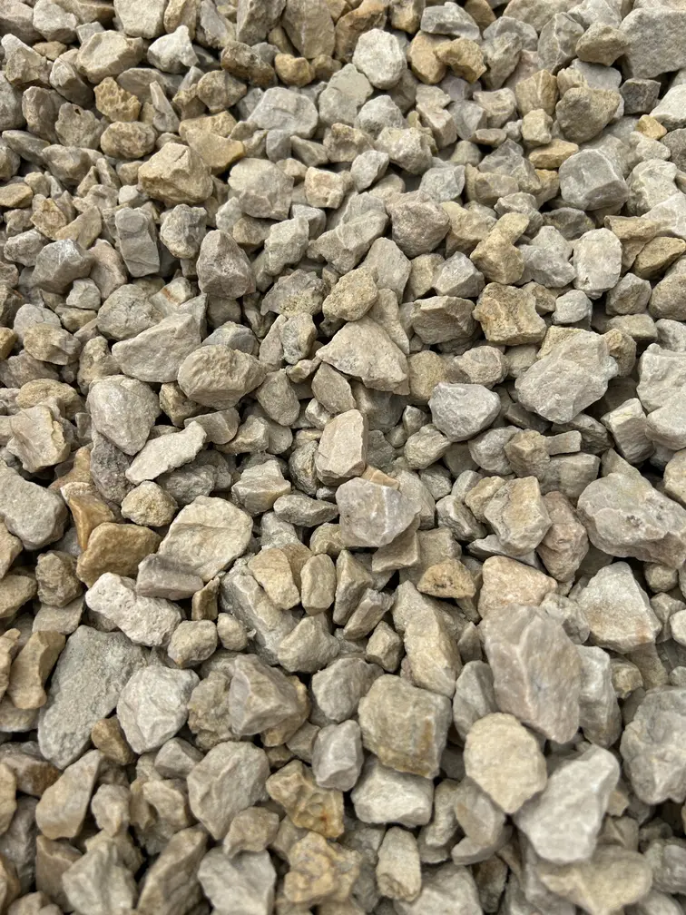 New gravel driveway being installed in Brierley Hill with compacted sub-base and decorative stone finish