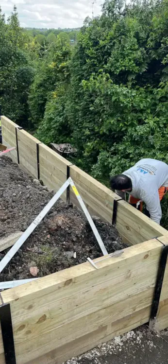 Heavy-duty timber sleeper fence with steel RSJ posts installed in Sedgley DY3